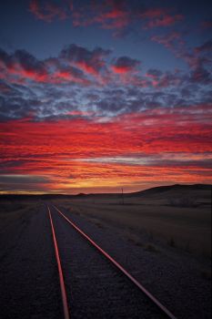 Railroad tracks along the Bad River Road at sunset.