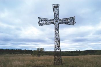 A 38-foot iron cross adorns the family cemetery at Brett and Tammy Prang's Frying Pan Guest Ranch. Photo by Bernie Hunhoff.