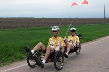 They ride a 27 speed, 10 foot long  tandem recumbent trike.