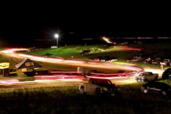 The scene after the rodeo as hundreds of cars descend from the Coteau Hills and into the night.