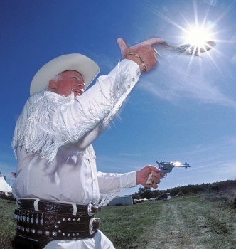 Sometimes you get really lucky like when this fancy gun spinner’s pistol rotated right into the sunburst. Fill flash kept the cowboy from being completely silhouetted.