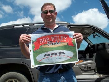 Chad Hesla shows off the Bob Wiley Classic tournament flag.