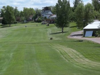 The #9 fairway – note the cart shed with ball-dented roof to the right.