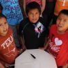 The survival of Lakota culture depends on the young. Last spring, students at North Elementary in Mission (Allen Antelope, Jeff Mandan and Loren White Hat) learned the Lakota flag song for their school s wacipi. Photo by Bernie Hunhoff.