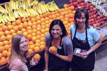 Pomegranate Market strives to attract like-minded farm suppliers, customers and staffers. In 2011, helpful staff members included (from left) Natalie McFarland, Kristen Perschon and Patty Ammann.