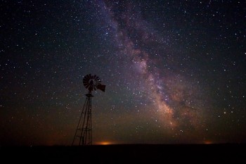 Taken just south and east of Isabel, SD in June. The lights of Eagle Butte, SD are on the horizon.