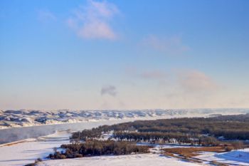 Steam from the open water rises in the Missouri River valley above the Oahe Downstream park area.