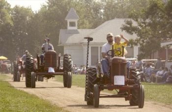 Tractors on parade at Madison's Prairie Village. Photo courtesy of the South Dakota Department of Tourism.
