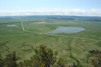 Camping and fishing are available at Bear Butte Lake just across Highway 79.