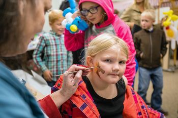 Face painting at the Fall Festival.