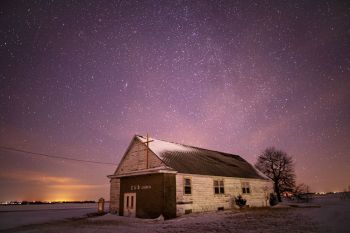 Brothersfield Evangelical United Brethren Church (Turner County) on a subzero winter’s night. The fuzzy star above the peak of the roof and a bit to the left is the Andromeda galaxy.