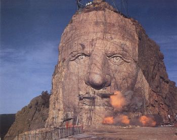 The morning sun illuminates the nearly completed face of the Crazy Horse sculpture, shown here in 1995, three years before its completion.