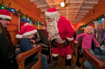Santa visits with kids on the 1880 Train's Holiday Express. Photo by <a href='http://www.dakotagraph.com' target='_blank'>Chad Coppess</a> of SD Tourism.