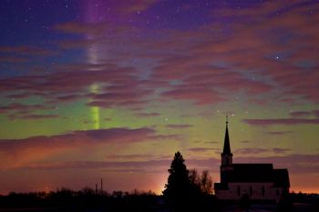 Oslo Church in Brookings County with departing clouds and faint Northern Lights.