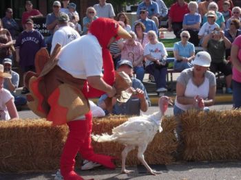 Huron's turkey handlers are not allowed to touch their racing turkeys, but may coax them to victory using other methods.