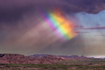 Remnants of a rainbow over Sage Creek Wilderness at Badlands National Park.