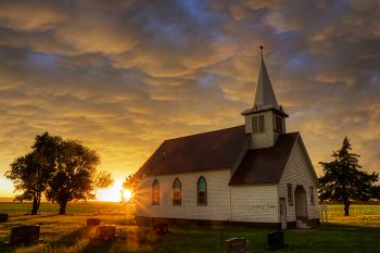 Trinity Lutheran near Platte as the first light after the storm broke through.